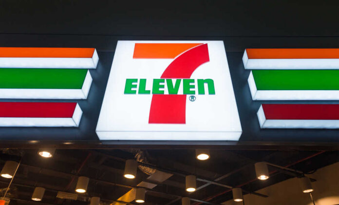 Kuala,Lumpur,-,June,17,,2017:,The,Signboard,Of,7 Exterior view of a 7-Eleven convenience store with All Cafe signage
