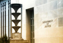 DOJ vs. Judge: Smuggling Case REVIVED? Exterior view of the Department of Justice building with architectural features
