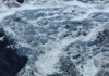 Glacier Ghosts Emerge After 34 Years Snowy mountain landscape with glacial ice and rocks