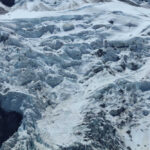Glacier Ghosts Emerge After 34 Years Snowy mountain landscape with glacial ice and rocks