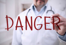 Killer Amoeba Lurks In Summer Lakes Doctor writing danger on transparent screen