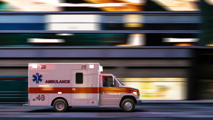 Ambulance,Driving,Through,A,City.,Ambulance,Drives,Down,The,Street