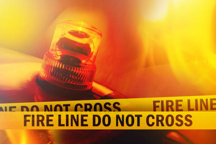 Firefighter emergency light with fire line tape