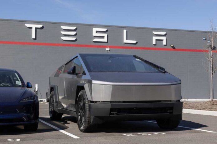 Tesla Cybertruck parked in front of a Tesla dealership