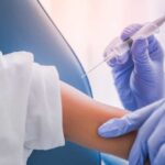 Pediatricians Revolt After Vaccine Shake-Up A healthcare professional administering a vaccine to a child's arm