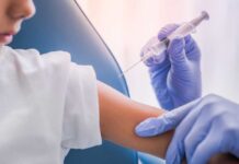 Pediatricians Revolt After Vaccine Shake-Up A healthcare professional administering a vaccine to a child's arm
