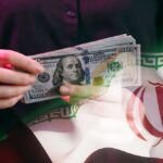 Economic D-Day: Trump Targets Iran’s Wallet A person holding a stack of US hundred-dollar bills in front of the Iranian flag