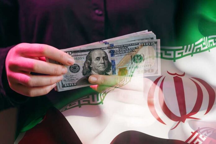 A,Person,Counts,Us,Dollars,While,Standing,In,Front,Of A person holding a stack of US hundred-dollar bills in front of the Iranian flag