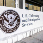 Noncitizen Voter Bombshell Rocks New Jersey U.S. Citizenship and Immigration Services building sign.