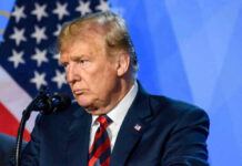 Gas Shock Torpedoes Trump? Donald Trump speaks at a podium.