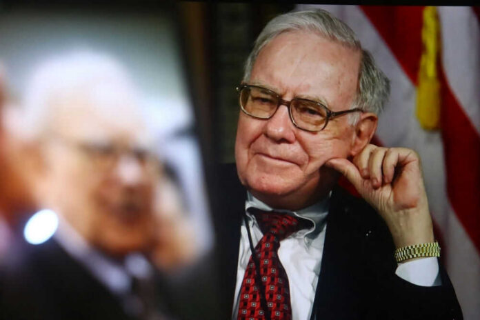 shutterstock2616400399jpg Warren Buffett seated in a suit, resting his hand on his cheek