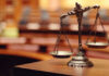 NEW Juror Bombshell Shakes Clancy Case Scales of justice in an empty courtroom.