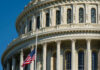 U.S. Capitol dome with American flag.