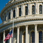 Quiet GOP Kingmaker Exits – Capitol Takes Note U.S. Capitol dome with American flag.