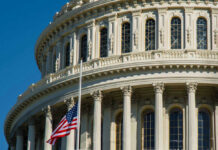 Quiet GOP Kingmaker Exits – Capitol Takes Note U.S. Capitol dome with American flag.