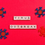 Summer of Outbreaks Becomes Election Issue?! Magnifying glass over berries showing bacteria