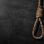 BOMBSHELL: Detective Says She Died Before the Hanging A noose made of rope hanging against a dark textured background