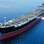 Oil Artery Under Fire A large oil tanker sailing on calm ocean waters
