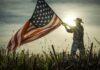 Rural Revolt: Trump’s Base Wobbling Person holding an American flag against a sunset backdrop