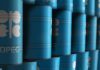 Blue oil barrels stacked in rows with OPEC logo