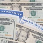 Social Security Checks To Get Boosted?! A collection of twenty-dollar bills and social security cards