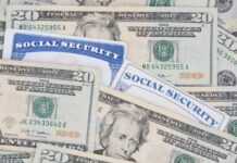 Social Security Checks To Get Boosted?! A collection of twenty-dollar bills and social security cards