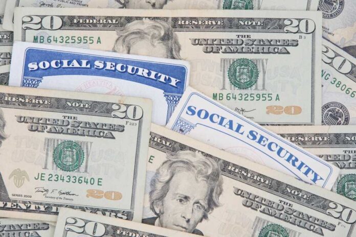New,And,Old,Style,Social,Security,Cards,With,20,Dollar A collection of twenty-dollar bills and social security cards