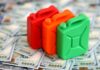 Three colorful plastic containers on a background of hundred dollar bills