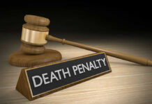 Horror Truck Case Sparks Capital Punishment Clash Gavel beside death penalty sign on desk