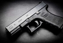 Deadly Gunfire Shocks: In-Laws Nabbed Black Glock 19 pistol on a dark surface.