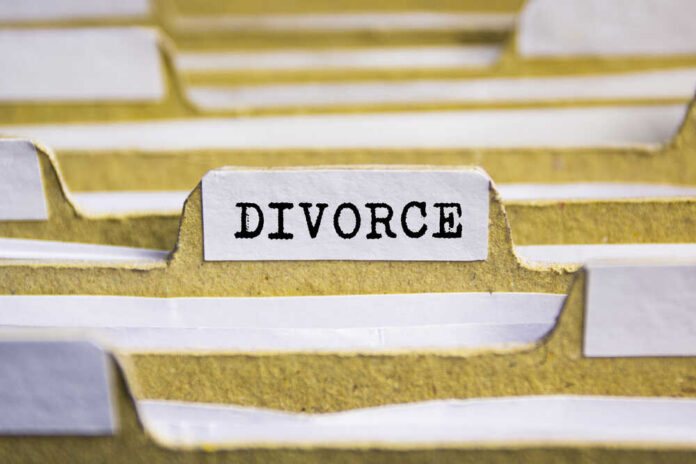 Divorce,Word,On,Card,Index,Paper Close-up of a file labeled 'DIVORCE' among other documents