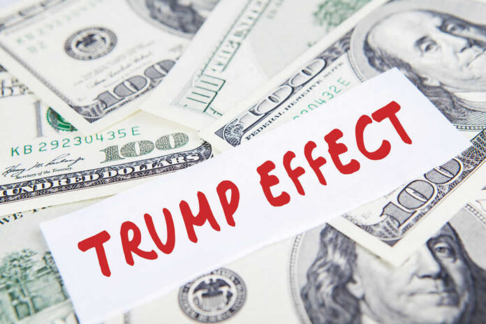shutterstock_519205120 Text Trump Effect over hundred dollar bills