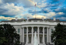 White House Praise, Then the Axe White House with a rainbow in the sky.