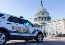 Capitol Speech Triggers Stunning Arrests Police vehicle outside United States Capitol building.