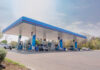 Gas-Station Meals Undercut Fast Food A modern gas station with fuel pumps and parked vehicles