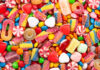 Halloween Stunt: Candy On Chicken Assorted colorful candies and sweets scattered in a pile