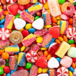 Halloween Stunt: Candy On Chicken Assorted colorful candies and sweets scattered in a pile