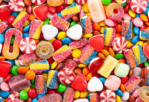 Halloween Stunt: Candy On Chicken Assorted colorful candies and sweets scattered in a pile