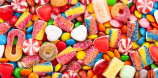 Assorted colorful candies and sweets scattered in a pile