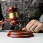 Firing Squad Returns – Trump Greenlights Execution Military person holding gavel near desk