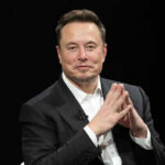 Musk Crowned – But Why Now? Elon Musk in a suit talking.