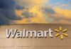 Retail Wars: Walmart Invades Amazon’s Backyard Walmart sign against a cloudy sky