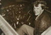 Amelia Earhart Clue Emerges Amelia Earhart seated in an airplane cockpit, looking toward the camera