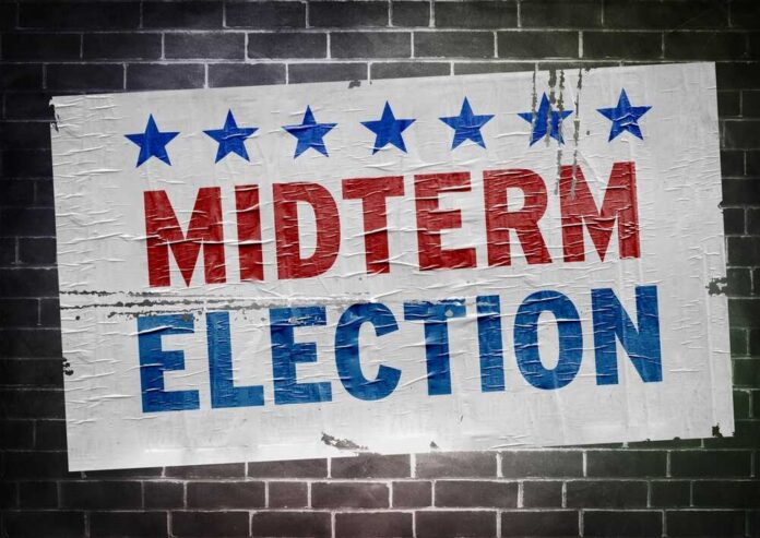 Us,Midterm,Election,Wall,Poster Midterm election poster on a brick wall