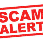 Red stamp with the words SCAM ALERT in bold letters