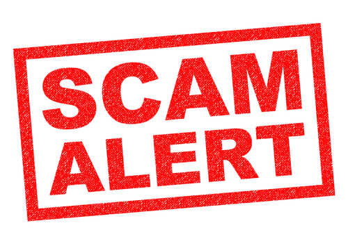Scam,Alert,Red,Rubber,Stamp,Over,A,White,Background. Red stamp with the words SCAM ALERT in bold letters