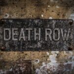 Death Row By Choice? Weathered metal sign reading 'DEATH ROW' on a wall