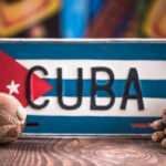 Rubio’s Gambit Jolts Cuba A decorative Cuban license plate with a maraca and a bundle of cigars